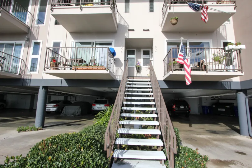 Two story residential building with parking at Glorietta Bay in Coronado California