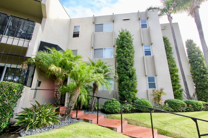 Sunny day at star park condos with trees and steps in Coronado, California.