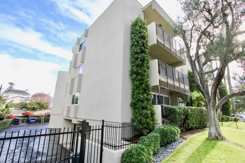 Apartment building in Coronado, California Star Park Condos. Side view with parking lot.
