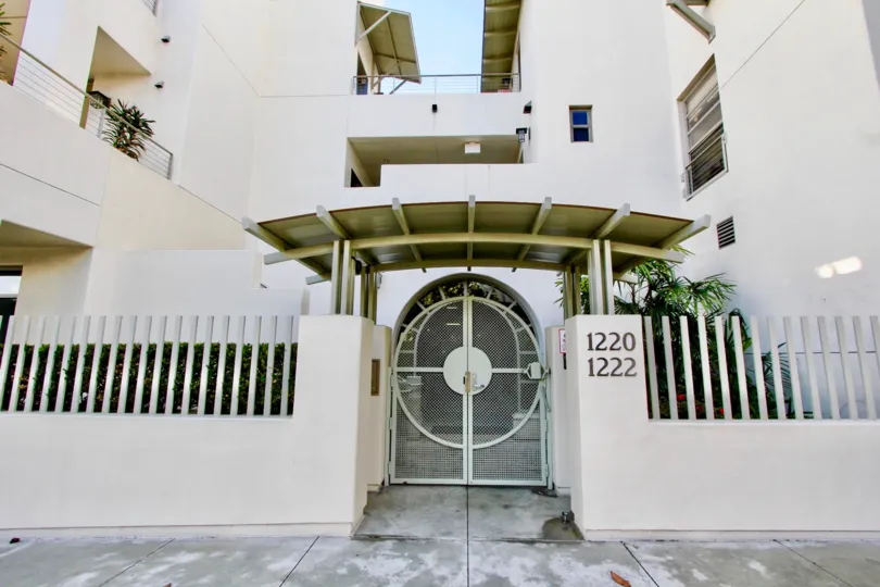 a beautiful white colored house with a good furnished entrance and door number,