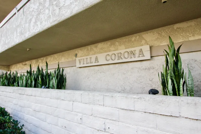 Community sign on wall at Villa Corona in Coronado California