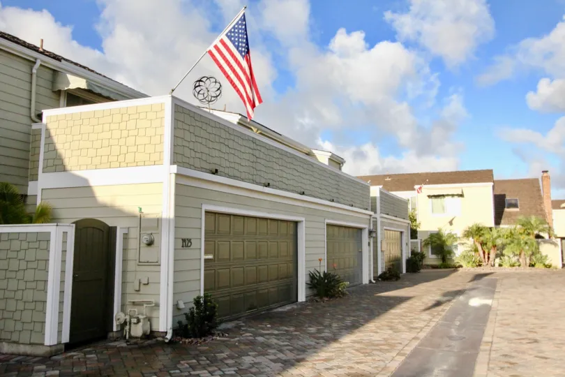 American flag hosted at the top of building at Village Townhomes at Coronado, California