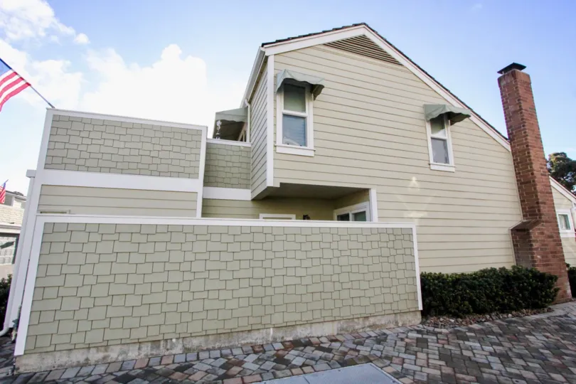 A house in the Village Townhomes is peculiar with flag waving the outside.