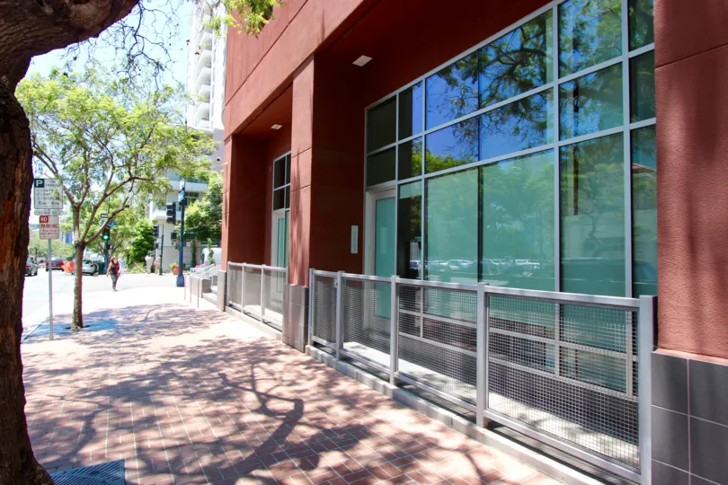 Sidewalk and Front view of 350 West Ash Condo Downtown San Diego California Red Block