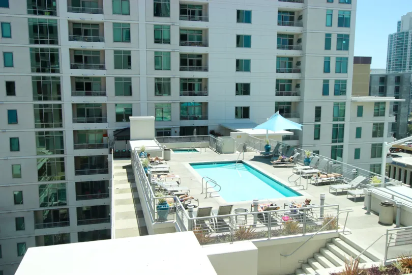 The Acqua Vista high rise condominium with a sun-drenched roof top pool in downtown San Diego, California