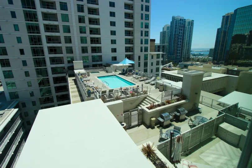 An overview of some tall buildings and a pool in Acqua Vista neighborhood