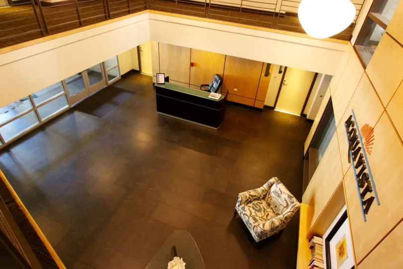 Lobby with hard wood floors and light furniture in Acqua Vista in Downtown San Diego CA