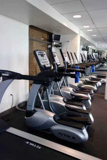 Workout room with fitness equipment at Acqua Vista.
