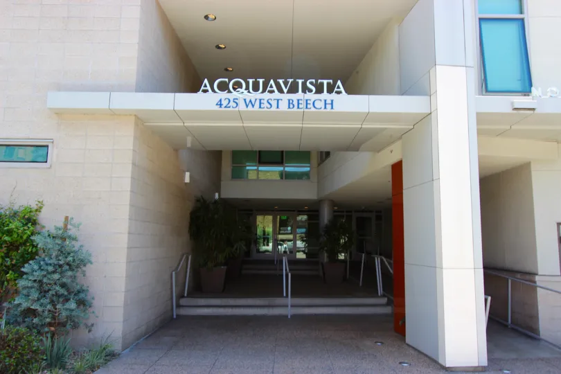 The exterior portico and glass door at the entry way of the Acqua Vista office building on West Beech