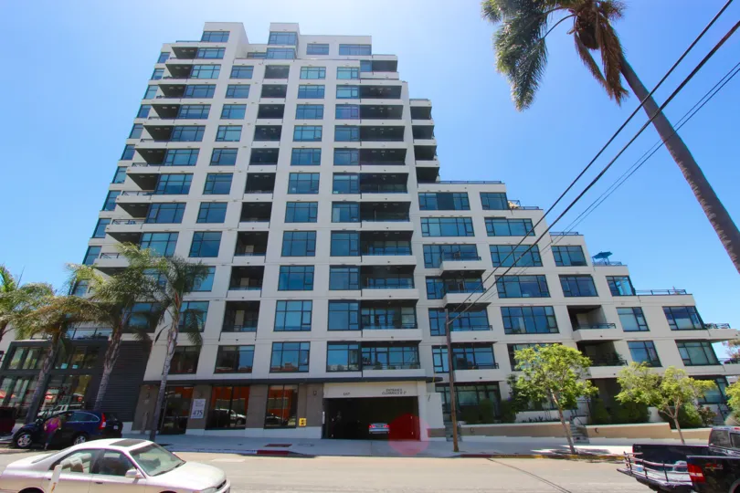 multi-residence high rise condo complex featuring modern architecture, large picture windows and private balconies in Alicante community of Downtown San Diego.