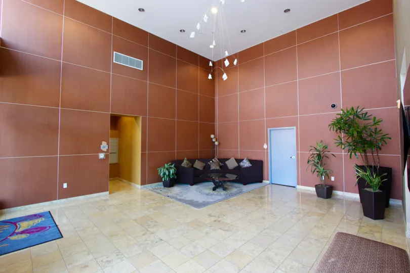A sunny day in the area of Alicante, lobby, couch, lights, door, elevator