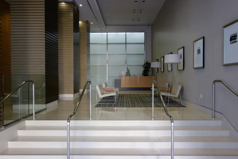 Shiny white steps leading to a seating area inside Alta in Downtown San Diego CA