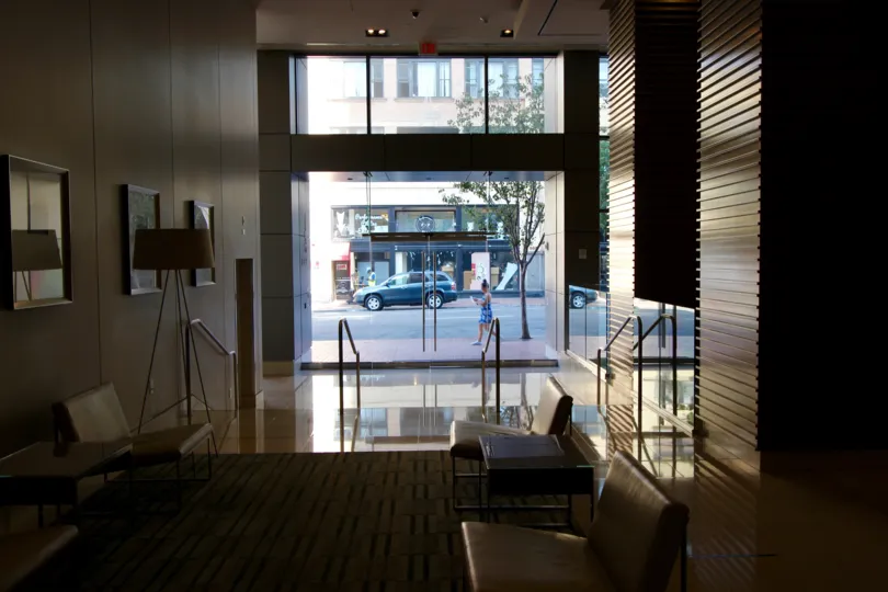 The lounge inside of the front entry way looking out onto the road.