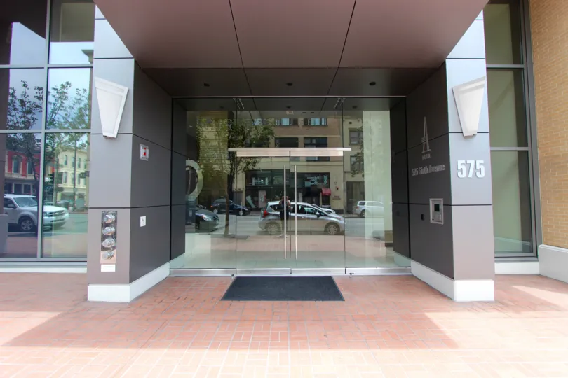 Modern yet inviting glass entryway in the Alta community of Downtown San Diego, California.