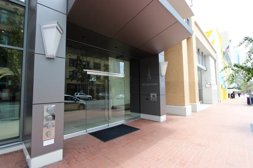 Glass door entrance at the Alta inside Downtown San Diego CA