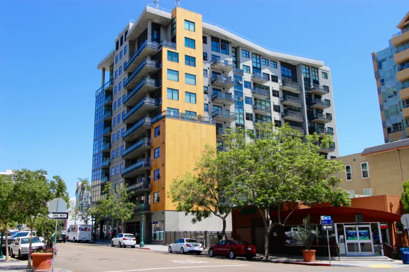 Clear blue windows gleam in the sun at the A high rise in the Aperture community in San Diego, California