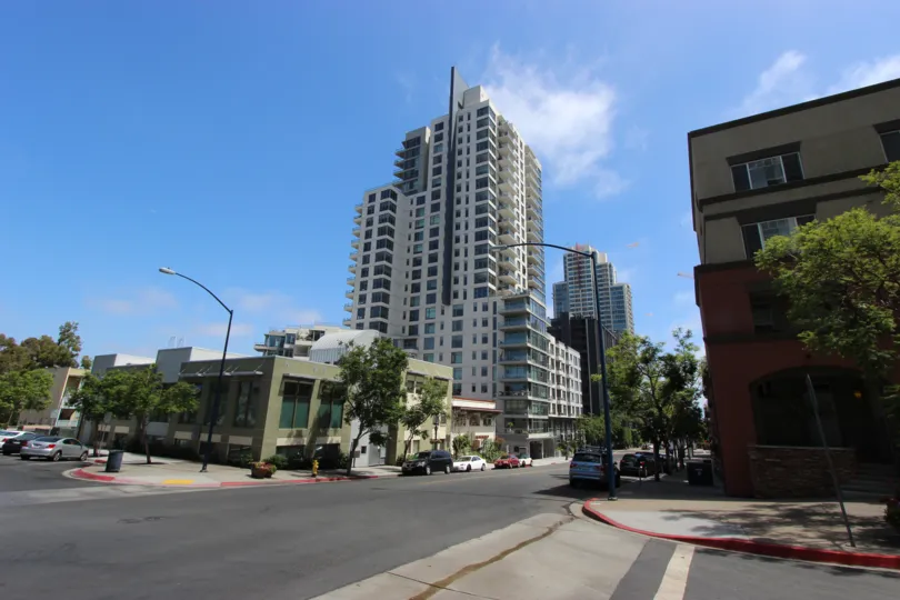 The tall white and blue Aria tower sits high in the city sky.
