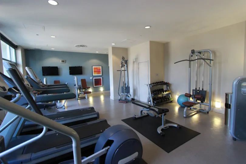 Treadmills and weight machines in the gym at Aria in downtown San Diego, CA.