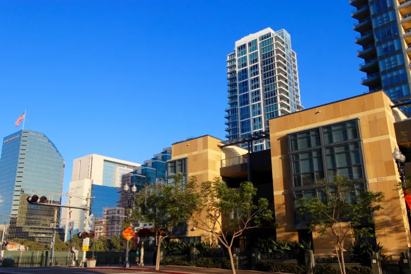 Brown marble covered residential building with trees at Bayside in Downtown San Diego CA