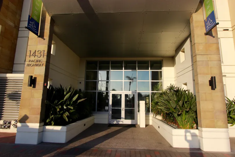 Two stone columns sit near the door to the main entrance at the Breeza condos