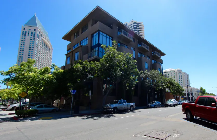 A corner view of a Brickyard building on a beautiful sunny day in Downtown San Diego, CA
