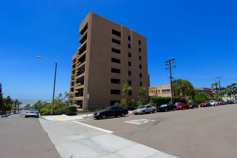 Tall brown building with windows near street at Brittany Tower in Downtown San Diego CA