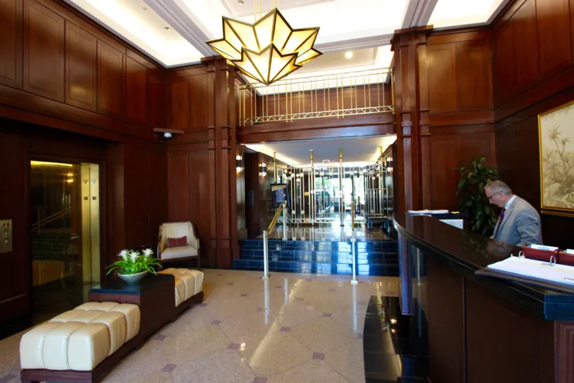 Beautiful lobby full of character in Downtown San Diego, California. The rich wood paneling, gleaming marble floor, and heavy furniture create a breathtaking yet cozy atmosphere.