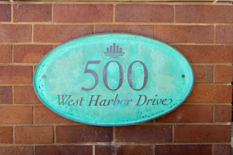 Unique address plaque on red brick wall at Cityfront Terrace in Downtown San Diego, California