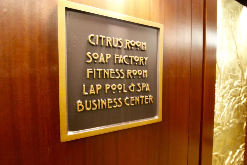 A sign for the Citrus Room, Soap Factory, Fitness room, Lap pool & spa and business center in City front terrace
