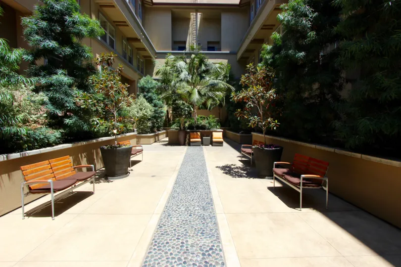 Private courtyard surrounded by greenery at Citywalk in Downtown San Diego, California