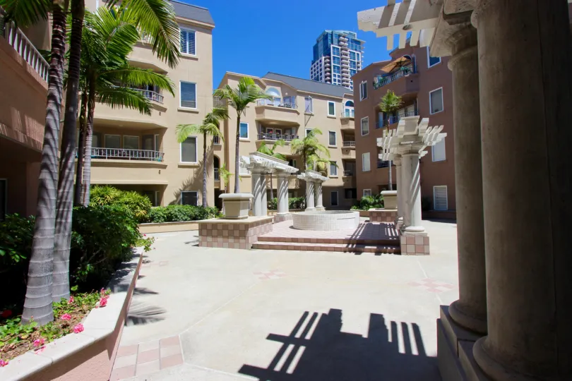 A sunny day in the area of Columbia Place, outside, stairs, palm trees, condos, sidewalk