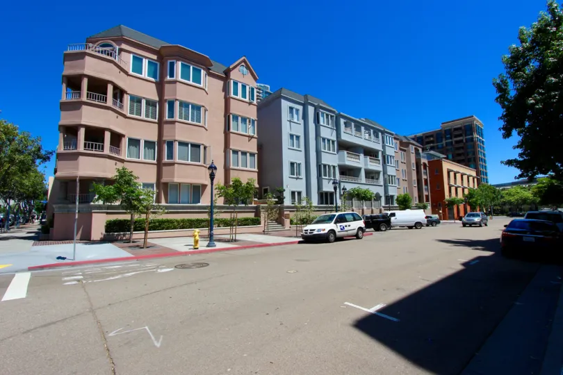 Parking near colorful residential buildings at Columbia Place in Downtown San Diego CA