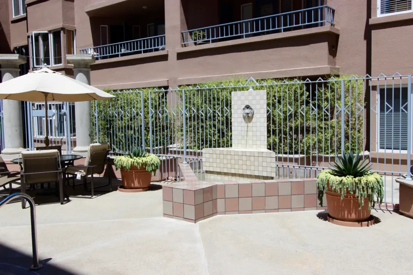 A fountain sits in a brick holder at Columbia Place condos.
