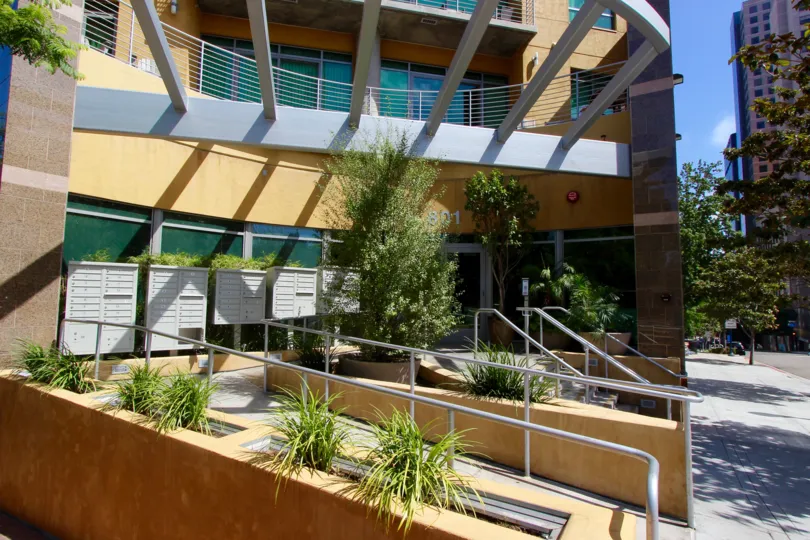 Vegetation and a sidewalk by the stairs leading to Cortez Blu in downtown San Diego, CA