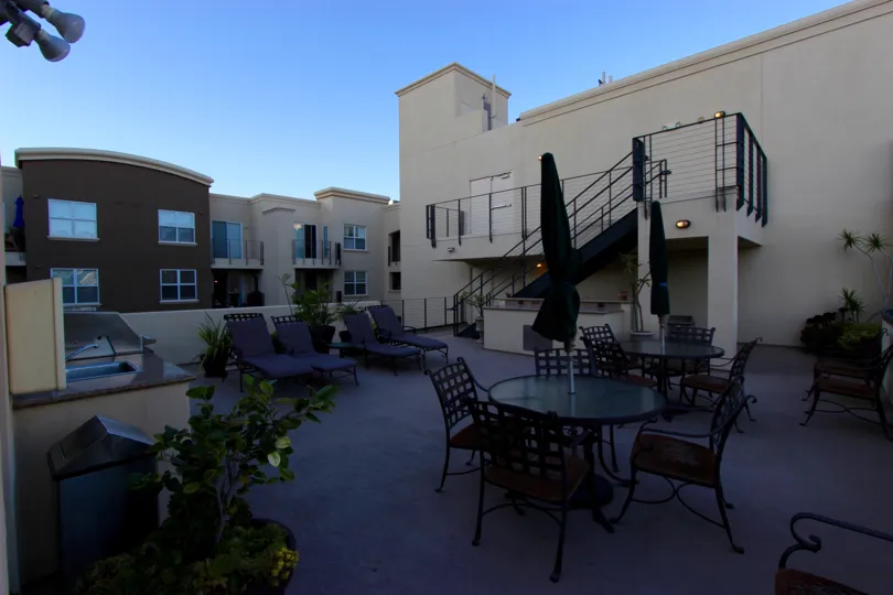 A secluded rooftop terrace, with comfortable lounge chairs and pool tables, at Crown Bay in Downtown San Diego, California