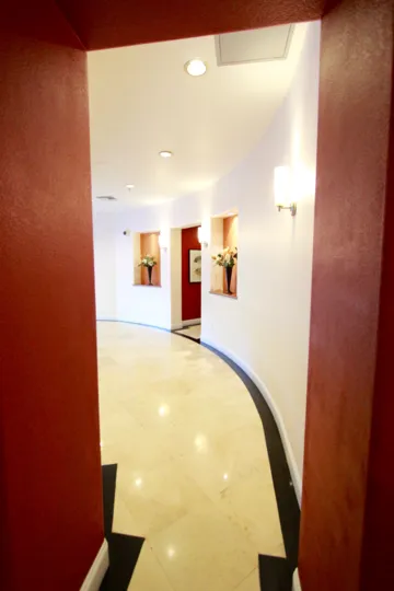 Oval shaped lobby with lighting and flowers inside Crown Bay at Downtown San Diego CA