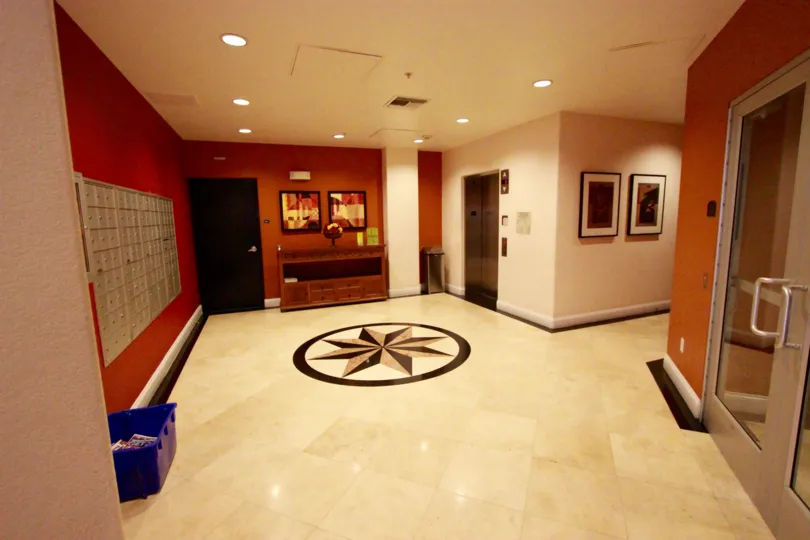Tiled floor with center design and matching coloring to the walls in Crown Bay.