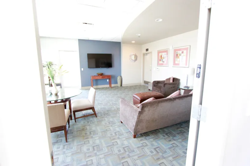 Glass top dinning table with nice wall hanging in the room in Diamond Terrace.