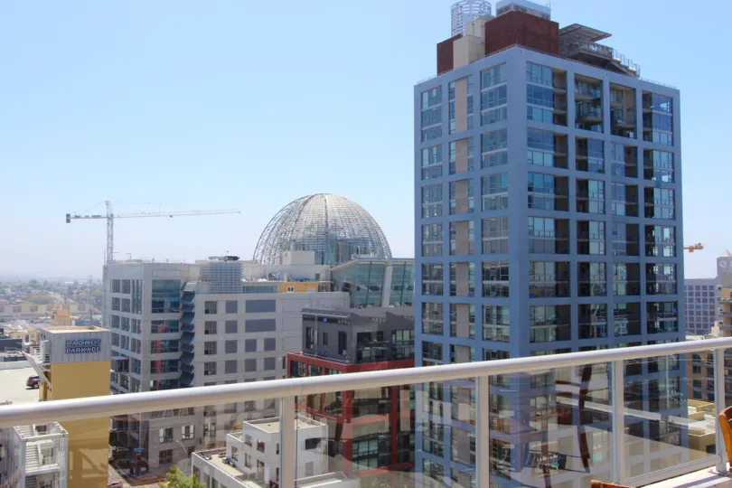 A few buildings, a dome and a construction crane in the distance, Diamond Terrace neighborhood