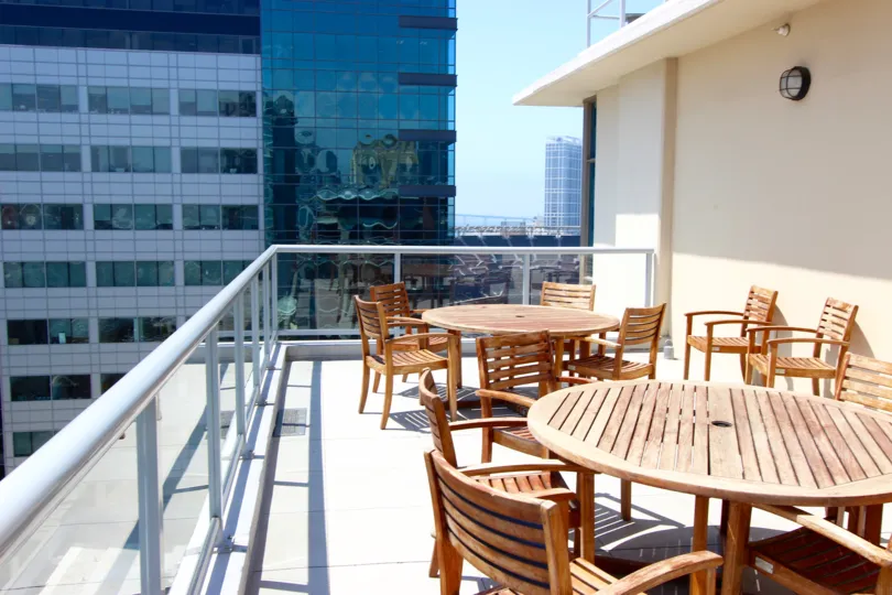 A porch with tables in Diamond Terrace in Downtown San Diego CA.