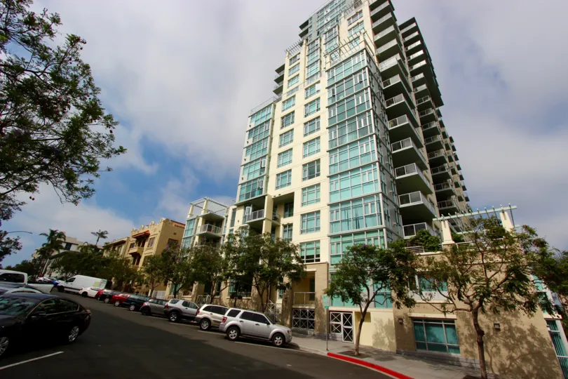 Street view of Apartment building, angled upward picture, trees lining the street
