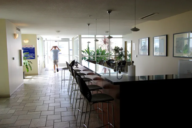 THE MEETING HALL IN THE DISCOVERY WITH TABLES, LIGHTS, PAINTINGS, AC.
