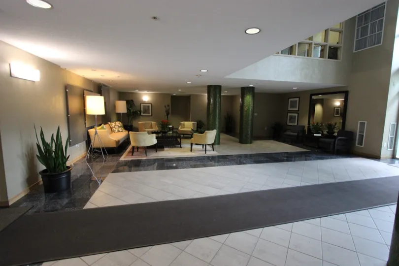 Inviting lobby with plush furniture and plenty of sunlight at Discovery in Downtown San Diego, California.