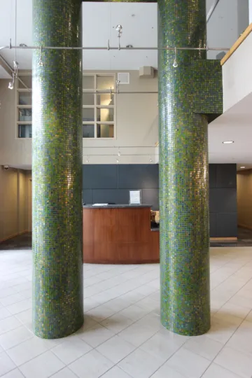 Green Mosaic Columns in the Foyer of a building in Discovery