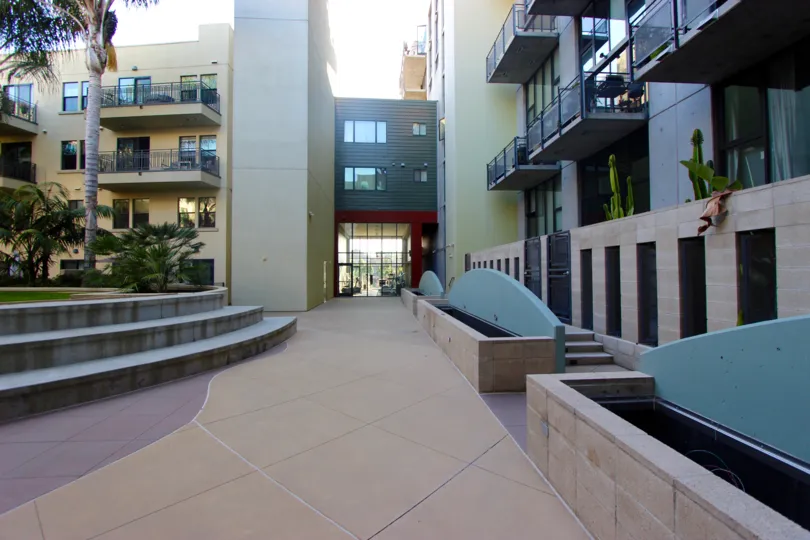A walkway with fountain detail and landscaping in DOMA