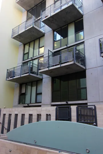 A sunny day in the DOMA with residential building with glass window.