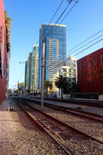 Train track in DOMA, Downtown San Diego, California with a city view on a sunny day