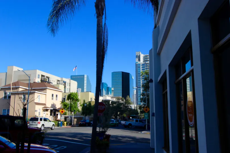 A street in blue shades on a cloudless day in DOMA neighborhood
