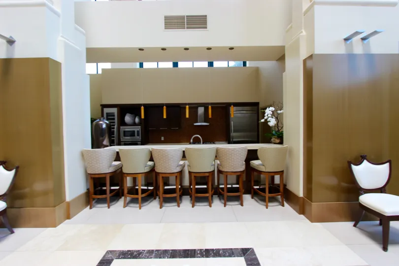 THE HOUSE IN THE ELECTRA WITH DINING HALL WITH DINING TABLES AND CHAIRS.