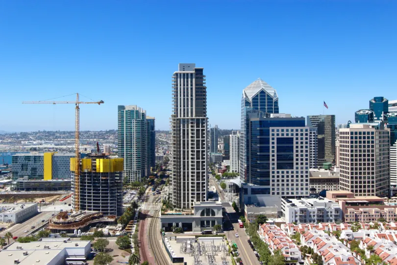 A view of the skyline of the Electra community including condos, high rise offie buildings, and a crane.